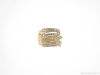 This diamond crossover ring is a staple in all its glitzy gilded glamour