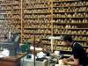 A shoemaker stitching a pair of bespoke Berluti shoes in the Berluiti maison