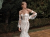 With ornate balloon sleeves, Camilla, an off-the-shoulder trumpet dress, offers a fine balance between beauty and grace with a corsetted top, sheer panels on the sides and a sheer back with 3D embroidered silk tulle | Photography by Philip Gay @philipgay