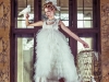 Dress by Anna Kania Couture; pearl necklace by Galerie Pearls Collection by Karin van Noort; feather headpiece by Honeymoon
