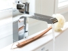 A faucet from Riobel’s Zendo collection adds a shimmering touch to a luminous bathroom