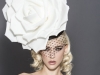 The Rose by Arturo Rios is comprised of a black pillbox covered in taffeta and Russian netting, adorned with an oversized foam rose on the side / Photo Courtesy Of Arturo Rios