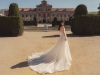 This Barcelona 2020 feature gown, with its cut-away back, sheer, pearl studded sleeves and neo traditional train, is stunningly dramatic and seductive | Photo Courtesy of Julie Vino