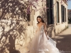 Dramatic and daring, this cut-to-the-waist gown features a tulle-like, whispering, multi-layered skirt | Photo Courtesy of Julie Vino