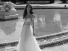 This strapless, cinchedat-the-waist gown features a cut-away bust and accessorized sleeves | Photo Courtesy of Julie Vino