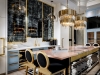 Large gold chandeliers combined with unexpected pale blue cabinetry are both stunning and subtle features of the stylish yet functional kitchen  | Photos Courtesy of Lori Morris