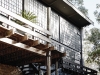 Button’s home features reclaimed factory windows, stone accents, brick walls and rough wooden floors