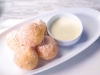 for dessert, indulge in zeppole: warm donuts topped with cinnamon sugar, orange cream and white chocolate sauce. Photos By Arnal Photography