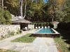 The Reflection Pool and outdoor fireplace heighten romantic evenings in the lush Westchester scenery.