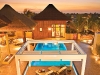A poolside nap or evening soiree finds its home at this South Pacific-inspired courtyard pool.