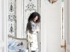 Tricia Guild, founder and creative director of Designers Guild, is framed by late 18th century inspired Bergius wallpaper from her spring/summer 2011 Linnaeus Wallcoverings Collection. Photo By Designers Guild / ©James Merrell