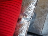 A Dior pleated cushion in a shade of red the designer created himself in 1947