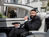 With the top down, DJ Khaled sits in the car that was featured in his single “Top Off” | Photography by Jesse Milns
