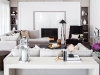 A classic, modern living room by  EM Design features dove-grey velvet and linen sofas by Kravet, a custom ivory lacquered sofa table, custom built-in bookcases and a Powell & Bonnell  contemporary wing chair upholstered in  a deep mink mohair fabric