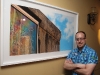 Artist Frank Michael poses next to his powerful work.