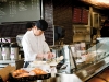 Japanese sushi chef prepares fresh sushi inside mcewan.