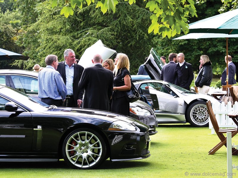 Guests commingle between coveted wheels.