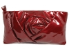 Lady in Red: This luxurious, lacquered leather rosebud in a cheery holiday shade makes for a girly companion to your little black cocktail dress.