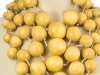 Big and bold is how Apfel rolls, and with five strands of large wooden beads wrapped casually around your neck, no one will say you’re trying to hold back. Photo By Vanessa Lenz Photography