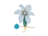 A symbol of longevity, the Jean Schlumberger Orchid clip blooms with emeralds, diamonds and a platinum turquoise pin in 18-karat gold.