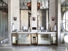 Country chic takes on new meaning in this glam master ensuite bathroom. Designed and built by the FR firm, it features floor-to-ceiling marble walls with mirrors, bronze frames and transoms, and an oversized spa shower with three sets of shower heads and controls