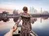 Dressed in an ornate gown, Nataly looks at the Taj Mahal in Agra, Uttar Pradesh, India