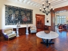 The main entry hall features gorgeous white beamed ceilings and pine inlaid floors