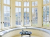 The large master suite enjoys views in three directions and includes a large sitting area alongside the oversized gas fireplace