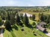 Along with the seven-acre kettle lake, this 101-acre property includes a four bedroom country home, a two- bedroom bunkie, a tennis court, a stone fire pit and a restored century barn with a workshop and winery room | Photos courtesy of Moffat Dunlap