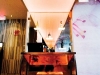 A sushi restaurant looks chic with a salmon-coloured backlight.