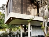 The first floor appears to almost float above the hollow ground floor. The landscaping by Patrick Watson is entirely indigenous and is designed to appear almost as an extension of the architecture. The design is based on a structured grid of grasses of varying textures and lengths picking up on the lines of the house