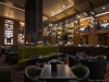 The main floor is inviting, engaging and anchored by a 35-foot wraparound bar, giving way to groupings of cosy booths, cocktail tables, club chairs and ottomans, all to encourage casual drop-ins and vibrant, social, interactive energy | Photo by Carlos A. Pinto