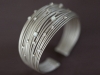 This mother-of-pearl silver wire cuff was inspired by the magic of tropical night skies