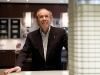 Isadore Sharp looks up to a model of the Four Seasons Hotel Toronto and Private Residences, which he describes as the “next generation of five-star hotels.” (Photography by Caitlin Cronenberg)