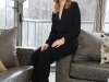 An authentic stage-set movie lamp overlooks Stewart as she sits in her downtown Toronto condo