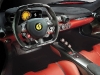 Inside, seats are part of the chassis to  lower weight, paddle shifters are bigger  and more ergonomic and the pedals and  steering wheel adjust to your preference