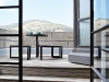 Because it was originally three units merged into one, the apartment has two corner terraces clad in wooden decking. This one overlooks Cape Town’s Signal Hill, from where a cannon is still fired every day at noon