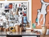 The Perspex desk is a mid-century modern classic and serves as Laureen’s work space. Her mood-board and collection of framed art-gallery posters, bought on her travels, completes the academic effect
