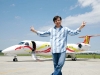 Jackie Chan, Embraer’s brand ambassador, stands proudly in front of his Legacy 650.