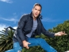 Howes is an Advisory Board member for Pencils of Promise, a charitable organization that creates schools, programs and global communities to promote accessible education for all / Dark Grey Theory trench coat Light Grey Cotton Zara Mens T-shirt Distressed AG Jeans Black Leather John Varvatos High-Top Sneaker | Photography by Robin Gartner