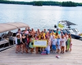 Party goers at Joan’s dock on Lake Joseph pose for a group photo (photo: George Pimental)