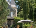 In the garden behind the castle, a pleasant swimming pool is set up facing the vineyards. Sun loungers, IKEA. Wicker garden sofa and parasol, Maisons du Monde. Cushions, Harmony | Photo By Gap Interiors/Julien Fernandez | Styling By Amandine Et Jules