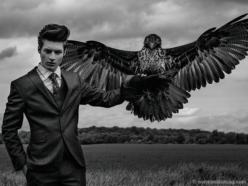 model in suit with bird
