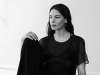 Top - Helmut Lang black sheer blouse  | Bra - LaPerla sheer triangle  | Pants - Cushnie et Ochs black wide leg trouser |  Shoes - Stuart Weitzman white mule |  Ring - Ana Khouri gold ring  | Earring - Zoe Chicco gold hoop with plate  / Photography by PULMANNS