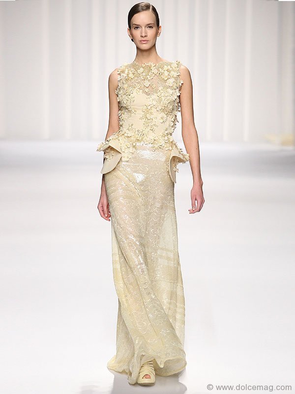 ▶ An angelic hue, a creamy texture and a touch of shimmer — this radiant gown is the stuff dreams are made of.