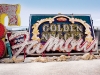 A piece of classic KFC signage can  be seen peering out through the beautiful mess of the Neon Boneyard North Gallery