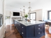This bold and beautiful blue island holds centre stage in this stunning hand-painted face-framed transitional kitchen. Designed by Aim Interior Design. Fabricated and installed by NIICO | Photos by Vanessa Galle