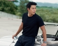Photographed on location with a classic car in South Korea, Bin is wearing a 40.5 mm stainless steel model from the new Speedmaster ’57 collection with a black dial | Photo Courtesy Of Omega