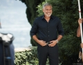 In a nod to Speedmaster’s racing heritage, Clooney is seen near his home on Lake Como, Italy, wearing the Speedmaster ’57 stainless steel model with a PVD blue dial | Photo Courtesy Of Omega
