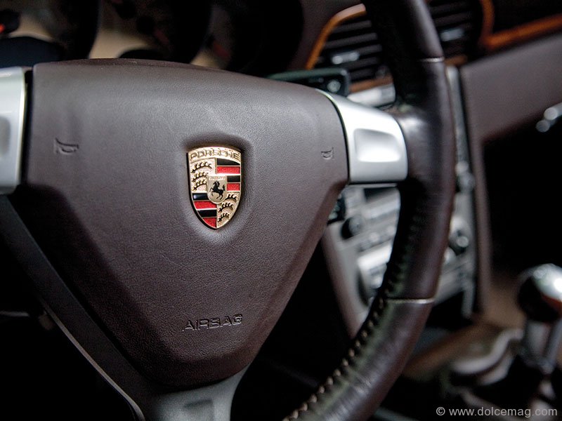 Porsche’s black stallion is a prestigious moniker on this brown leather steering wheel